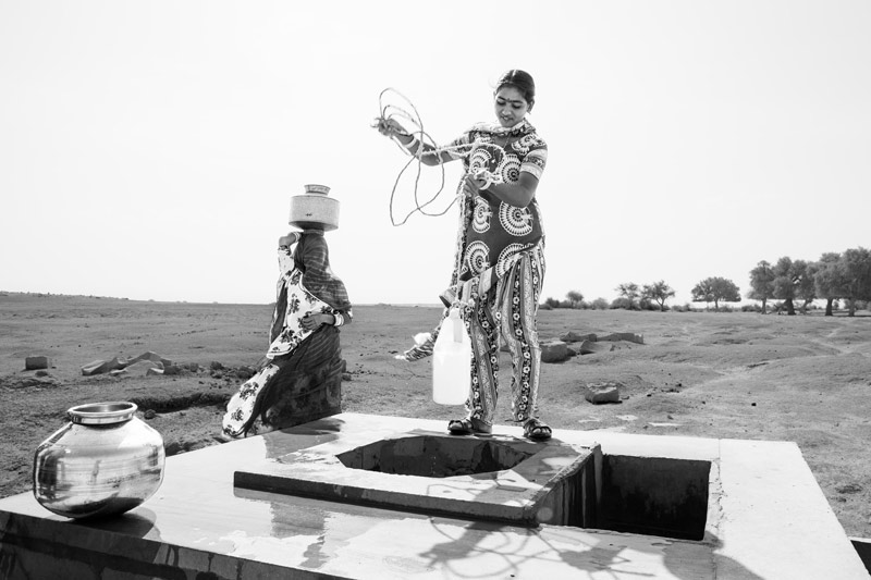 Nature-based solution for quenching thirst in the driest place of India - Procuring  drinking water from a 'beri' (shallow well) in the dry bed of Viprasar, a rainfed pond in Thar Desert, Jaisalmer district, Rajasthan